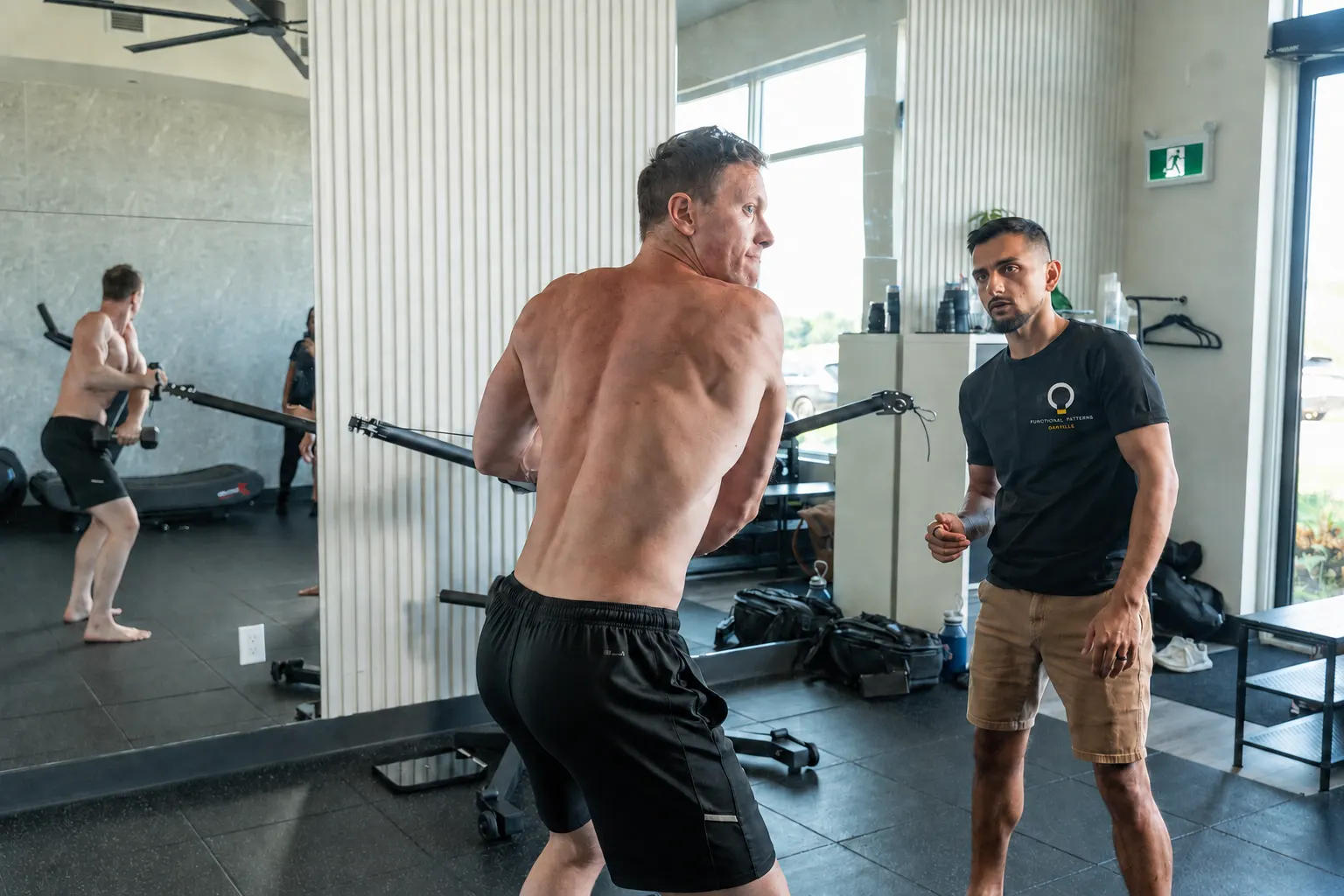 Practitioner coaching a client through a rotational pattern
